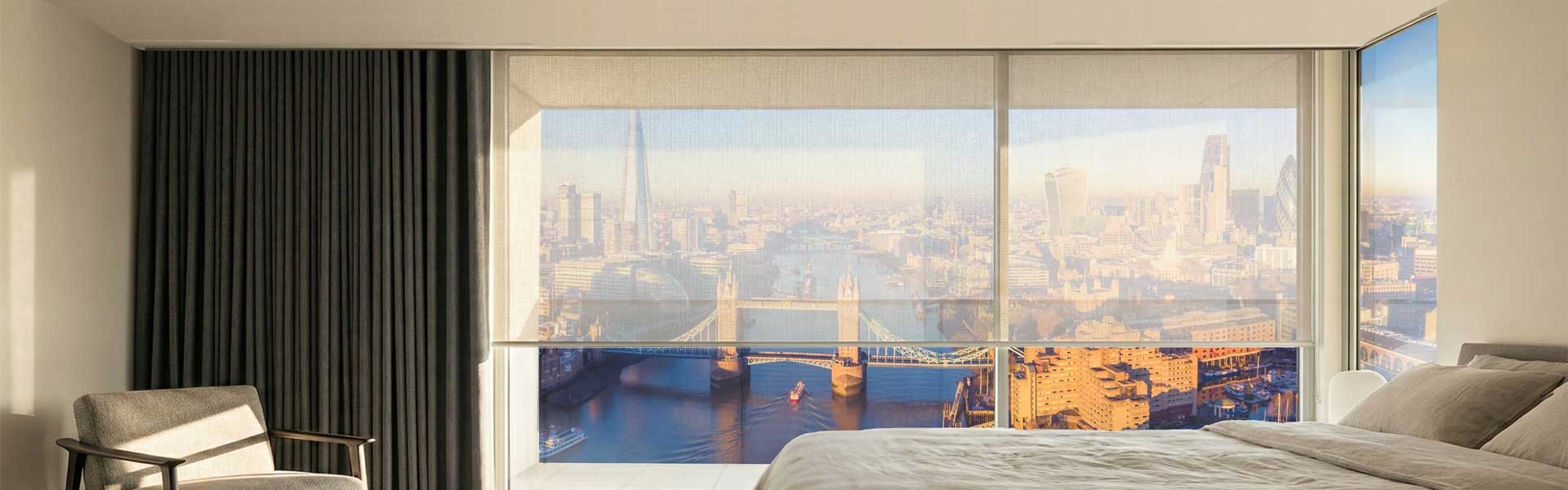 Bedroom showing black-out curtains and day-time blinds